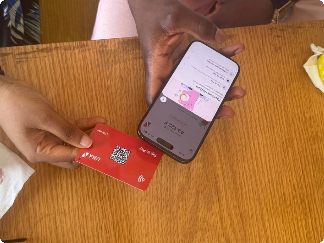 Customer tapping a UBA PayChap card on a phone